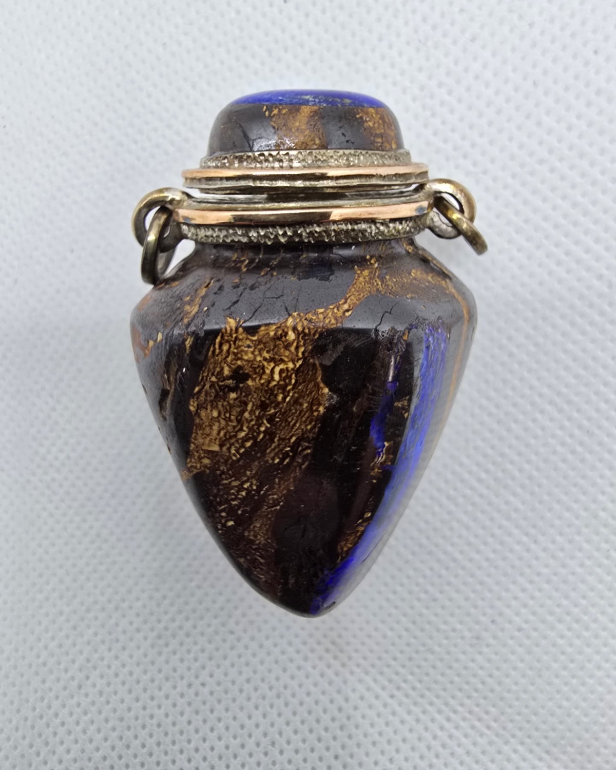 Dark gold-veined stone amphora vessel with lapis lazuli stopper, front view