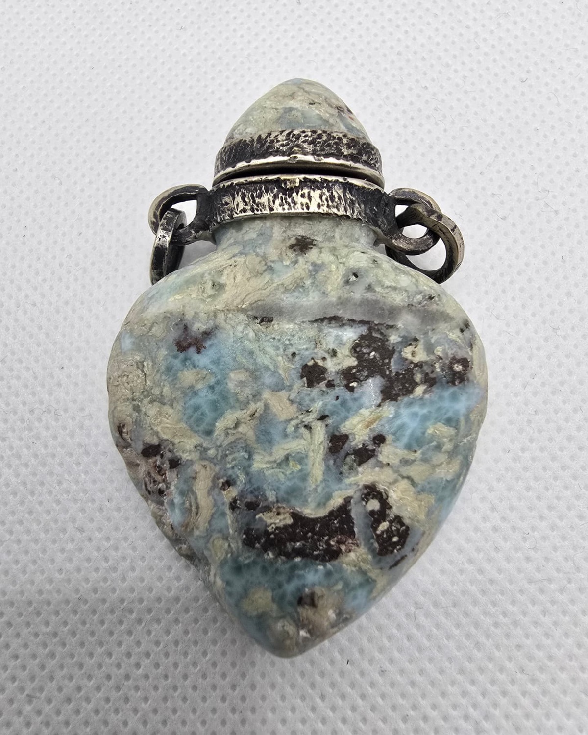 Blue K2 stone heart-form vessel with silver mount, front view