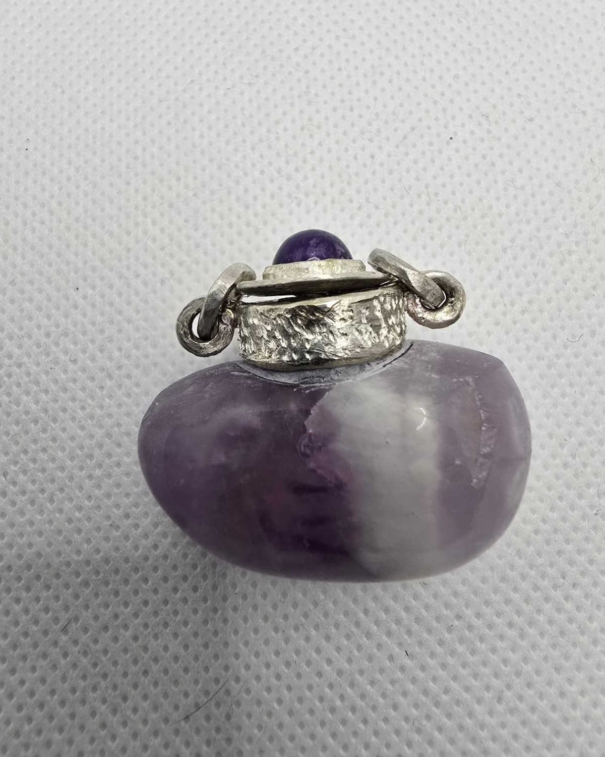 Amethyst vessel with silver collar, reverse view
