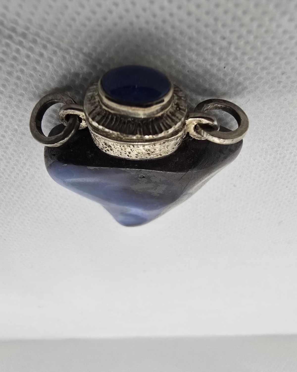 Blue opal heart-shaped vessel from above, silver collar and cabochon stopper