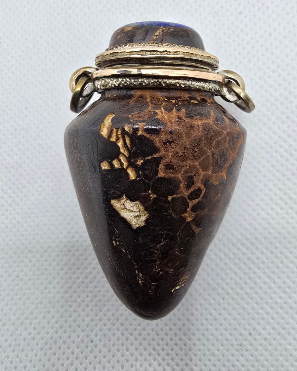 Dark gold-veined stone amphora vessel, reverse showing lighter matrix