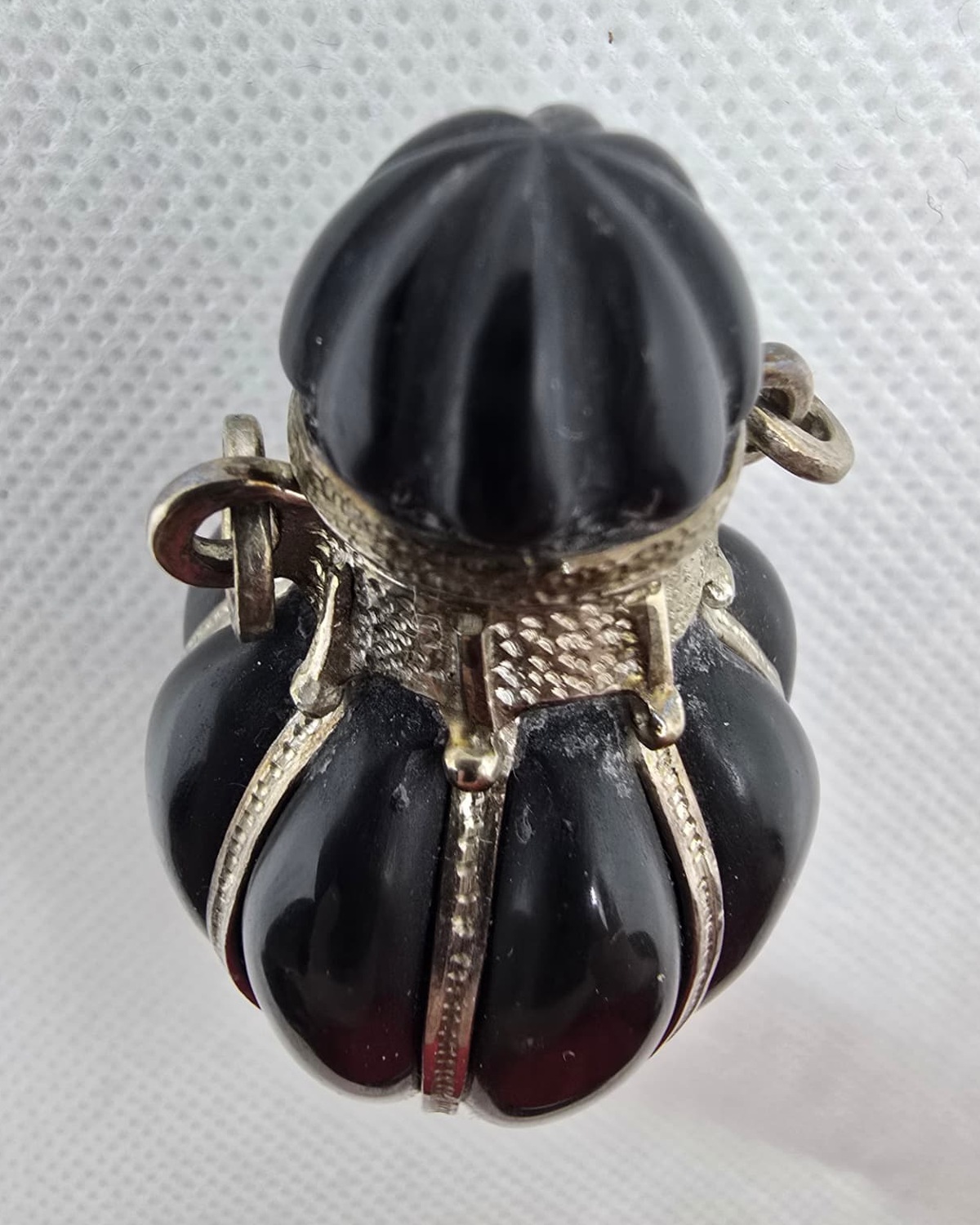 Black fluted onyx amphora viewed from above, silver filigree collar