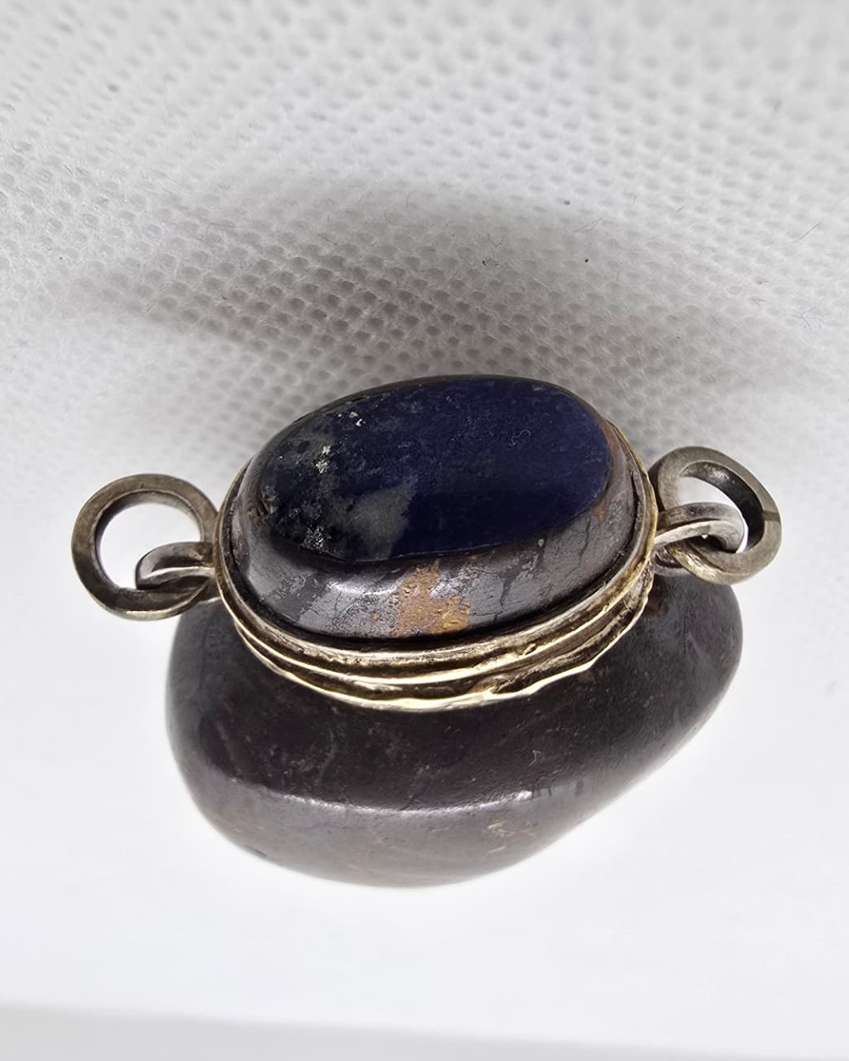 Dark boulder opal vessel, stopper and silver collar detail