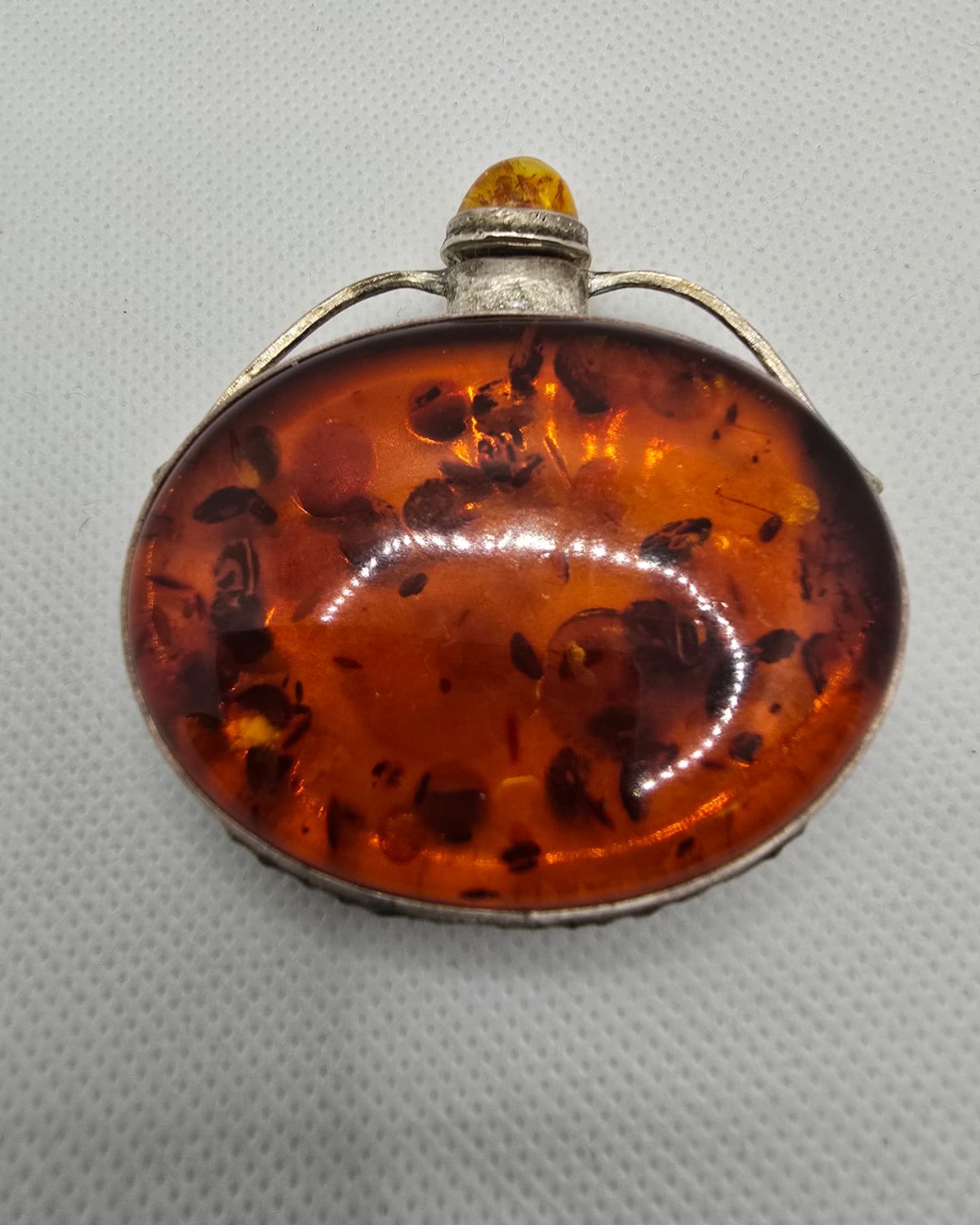 Amber and silver flask with fluted silver mount, front view