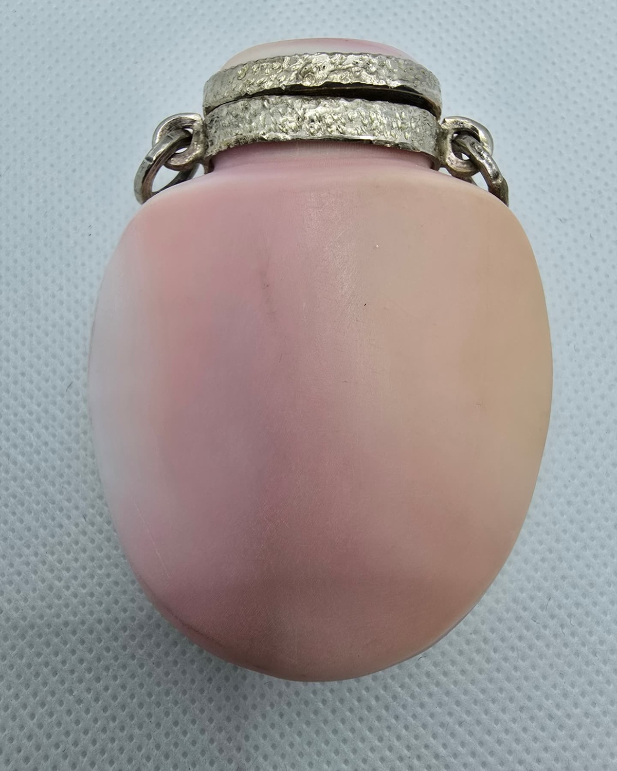 Pink sea shell vessel with silver mount, reverse view