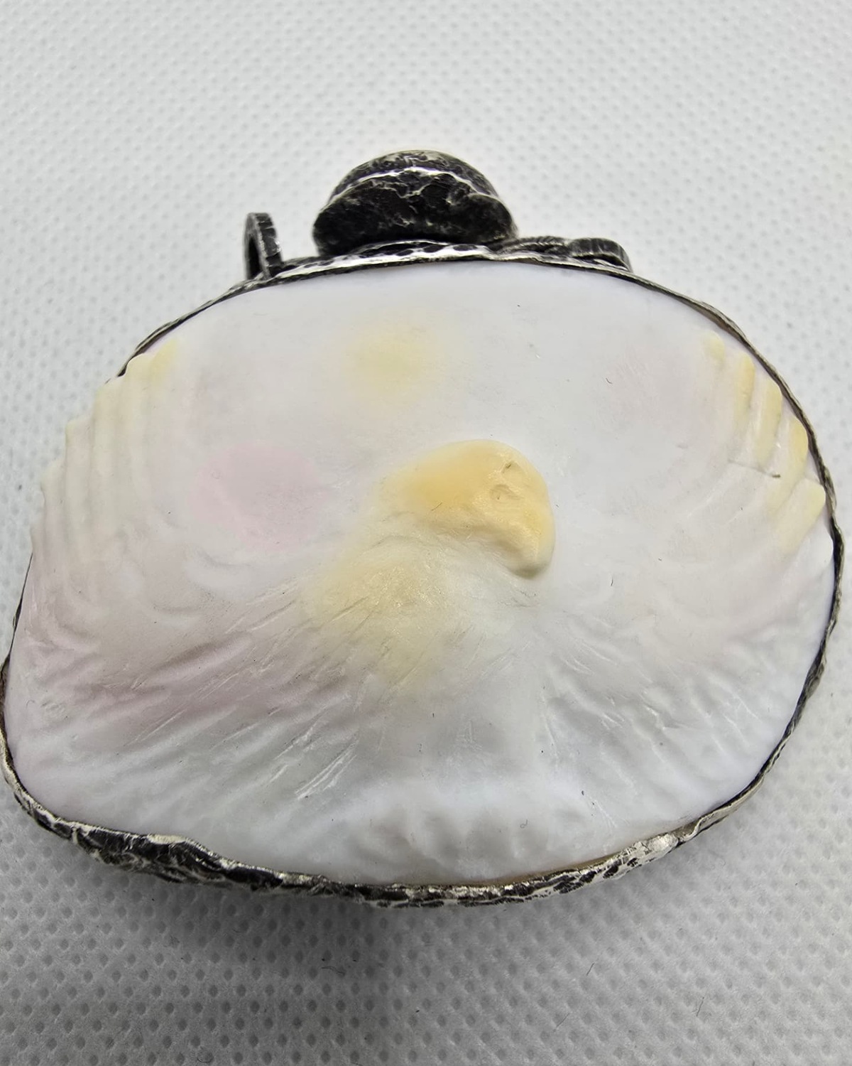 Carved sea shell vessel with eagle motif in mother of pearl, front view