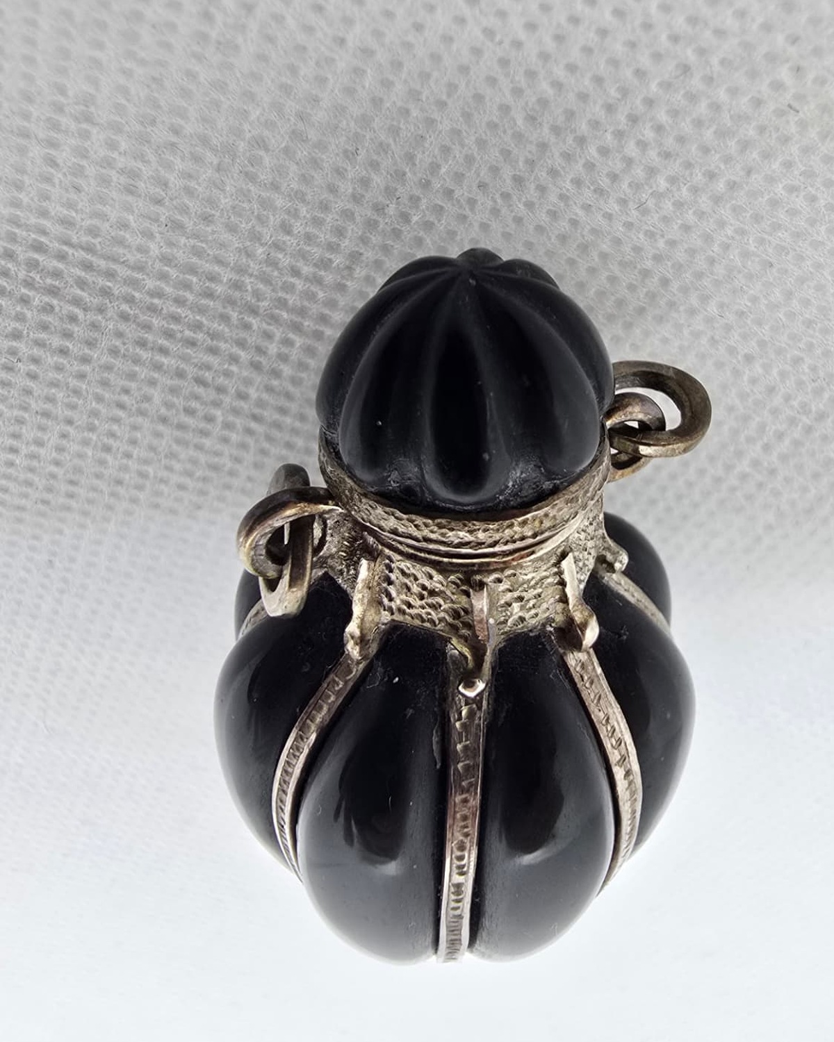 Black fluted onyx amphora, carved stopper detail