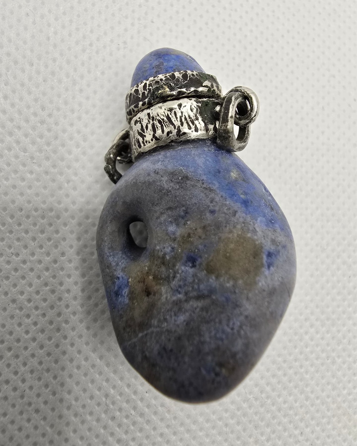Blue sodalite pebble vessel, reverse view
