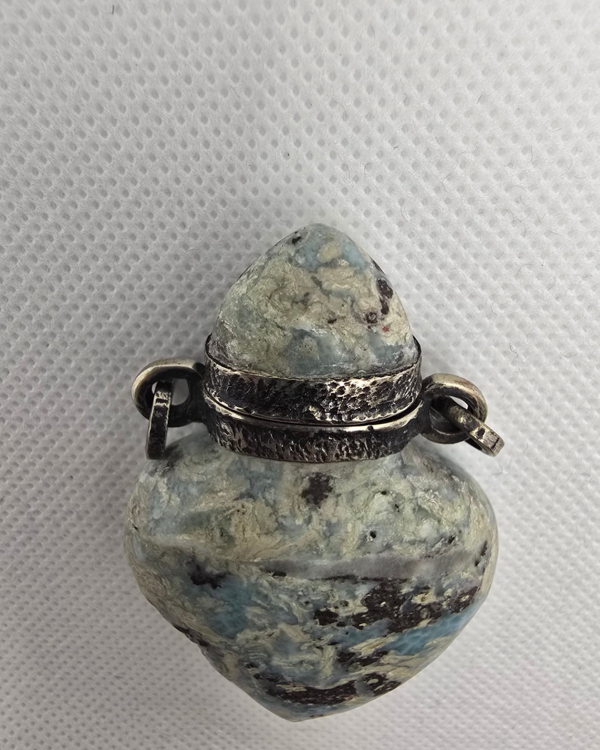 Blue K2 stone heart-form vessel, neck and silver collar detail