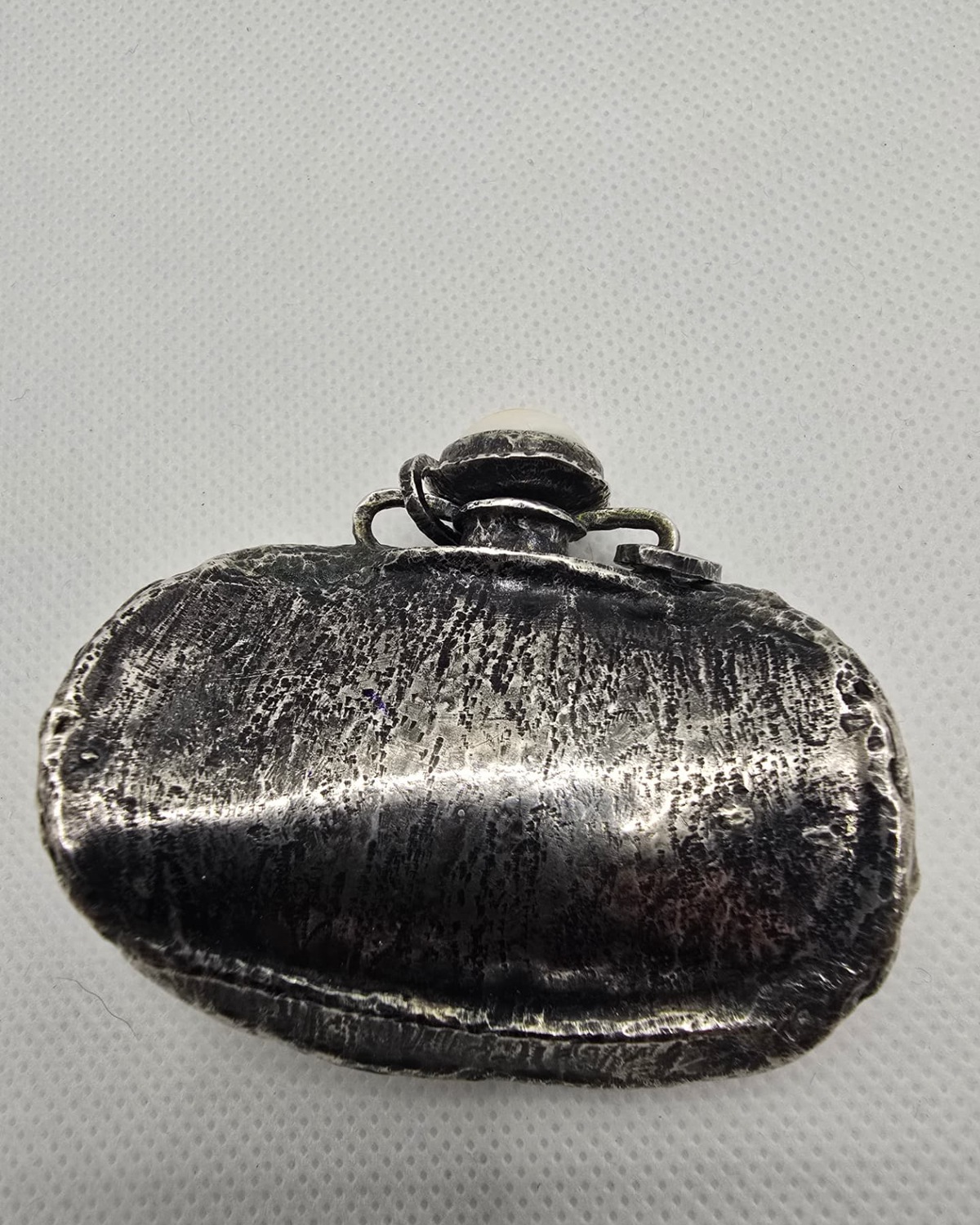 Carved sea shell eagle vessel, silver reverse view