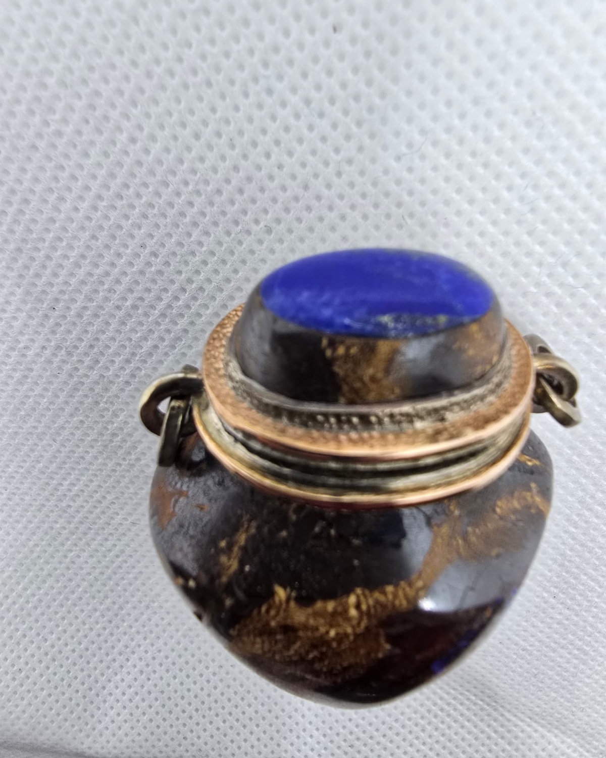 Dark gold-veined stone amphora vessel, alternate front view