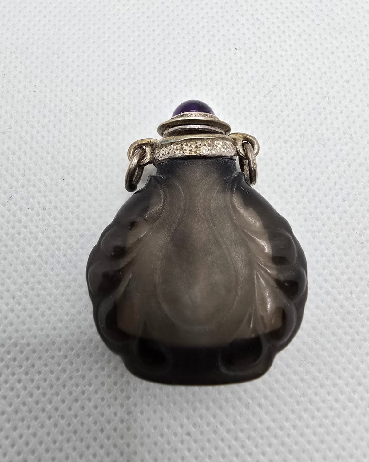 Smoky quartz lobed vessel with silver mount, profile view