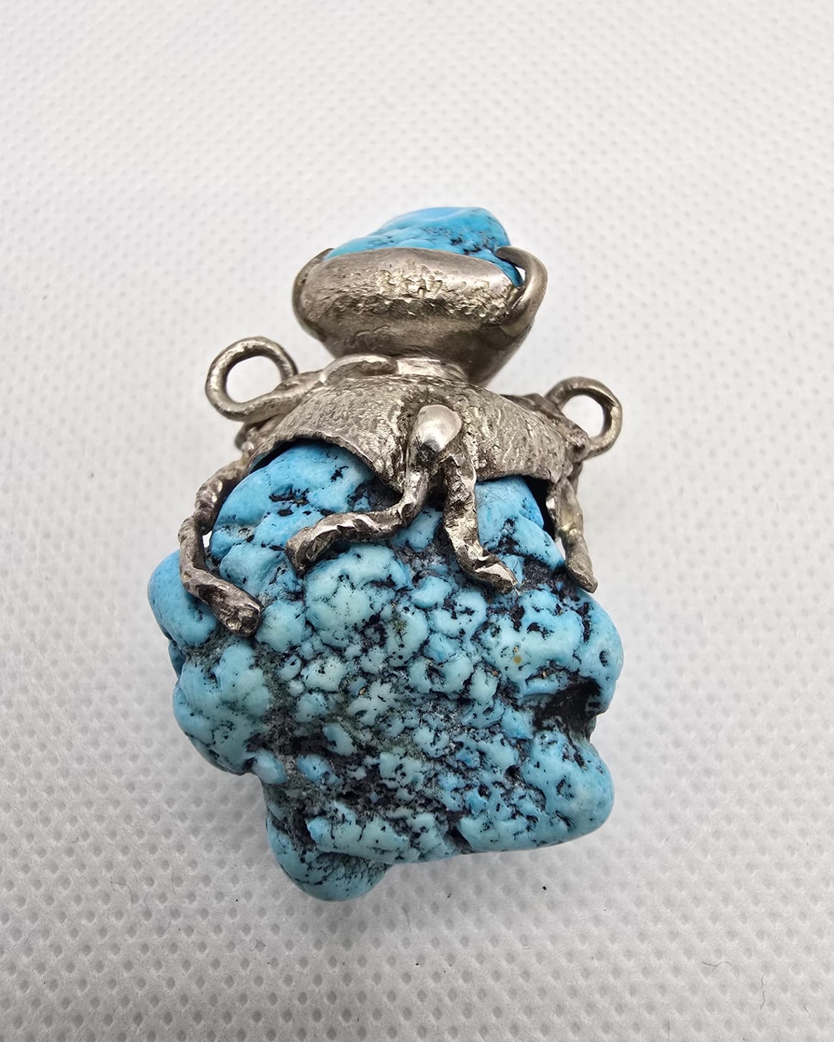 Natural turquoise nugget vessel with silver mount, front view