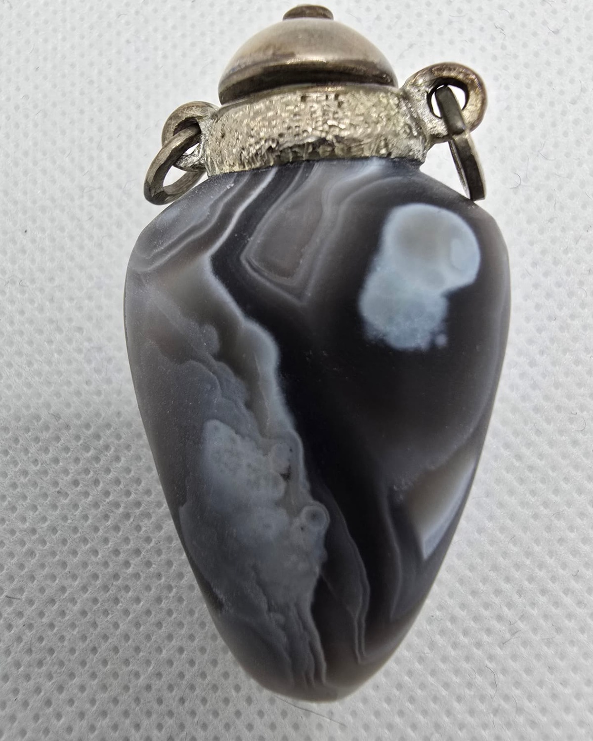 Hand-carved banded agate vessel, reverse view showing natural banding