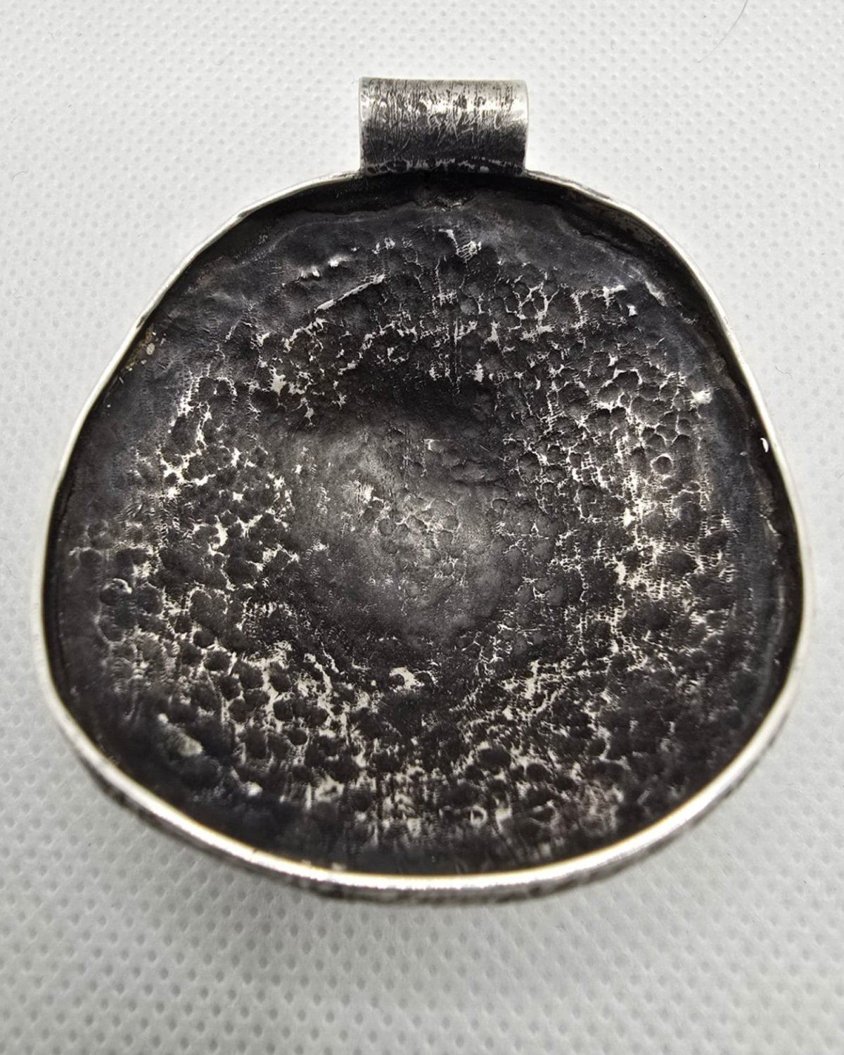 Mother and Child — reverse showing the extensive handcrafted textured silver metalwork and large integrated bail