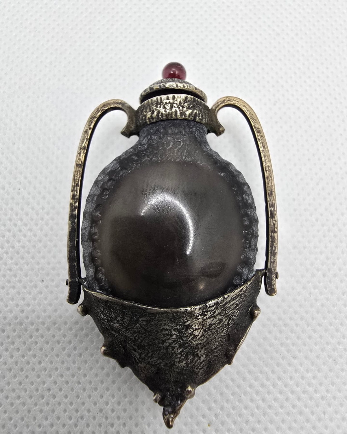 Dark sculptural amphora, reverse view