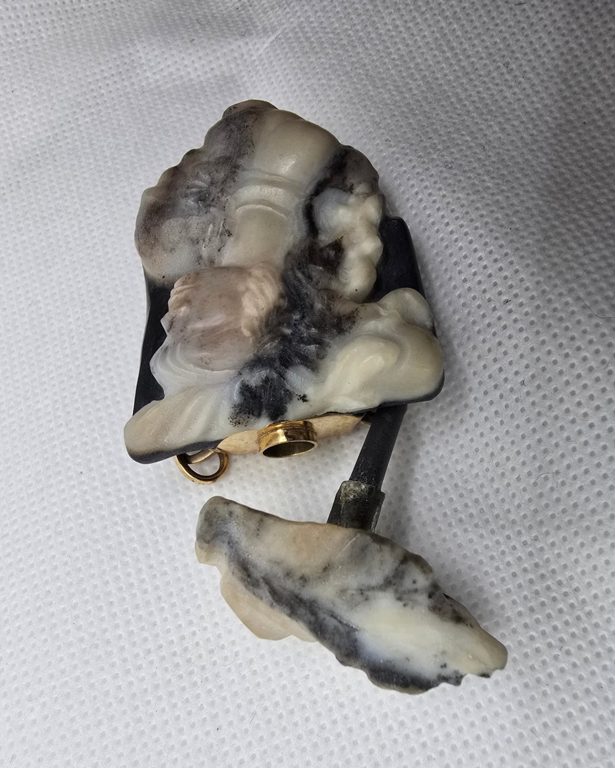 Carved cameo plaque vessel with stopper removed, showing gold collar