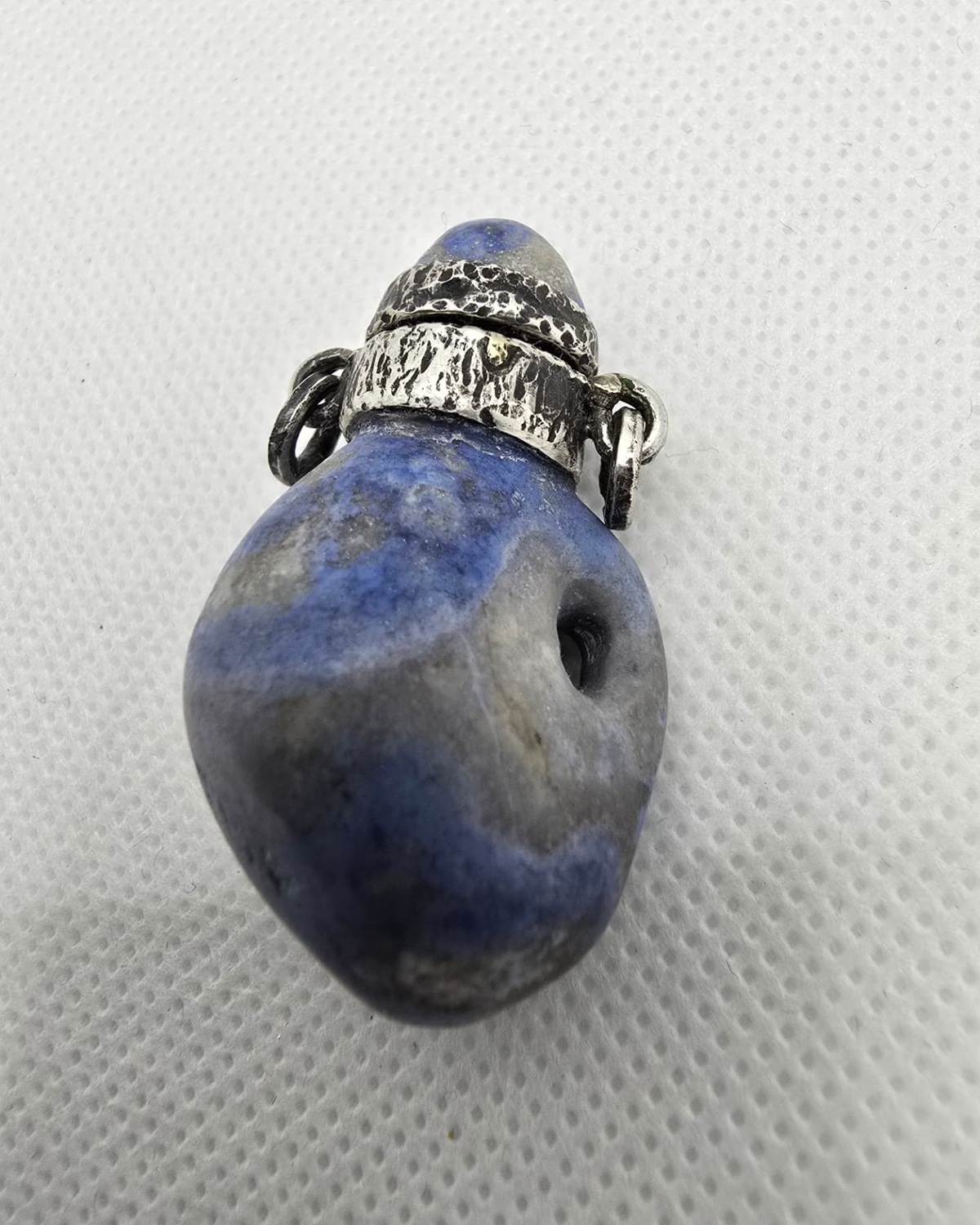 Blue sodalite pebble vessel, front view