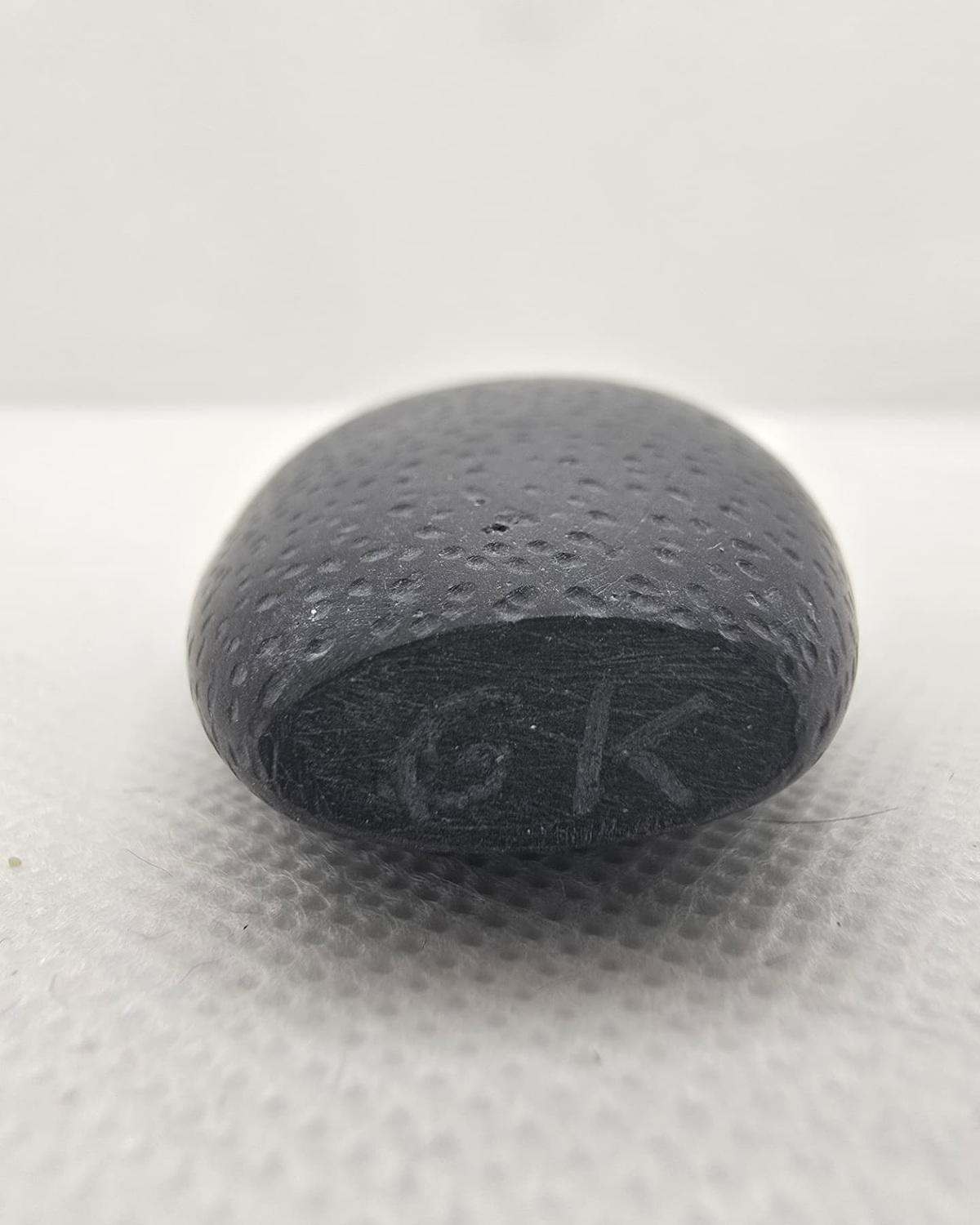 Base of the black basalt vessel showing the carved GK signature