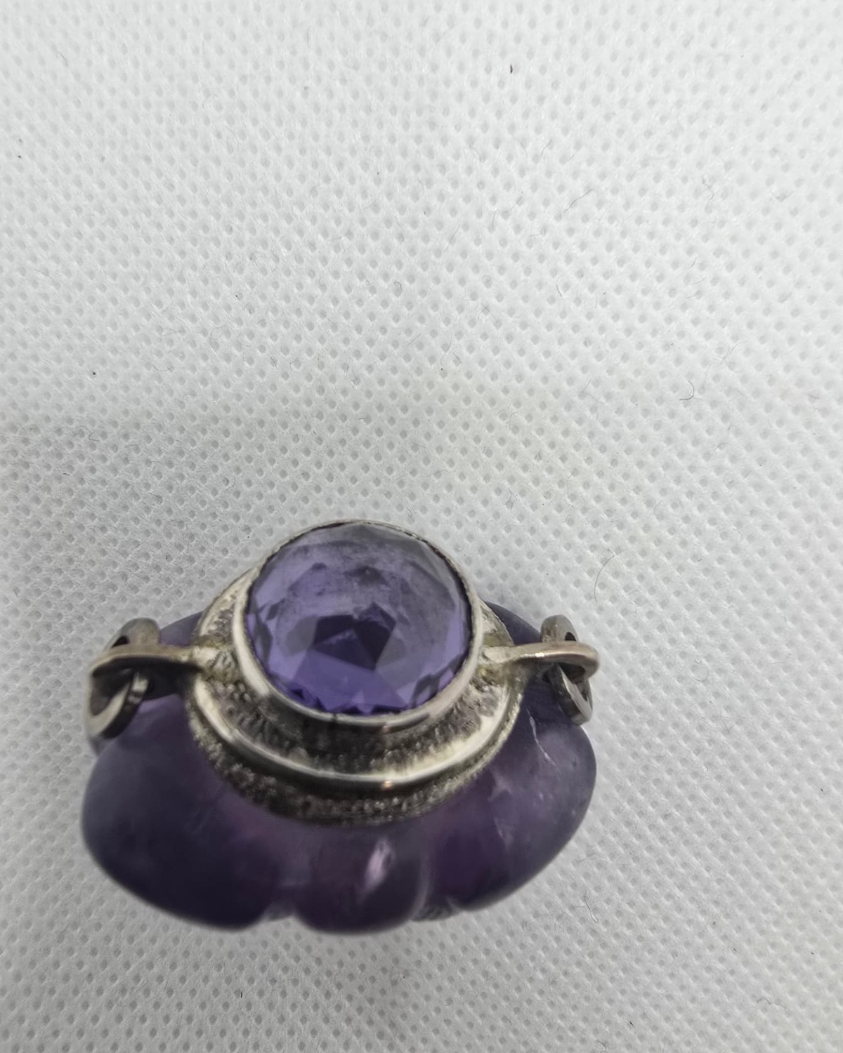 Amethyst vessel, neck and faceted stopper detail