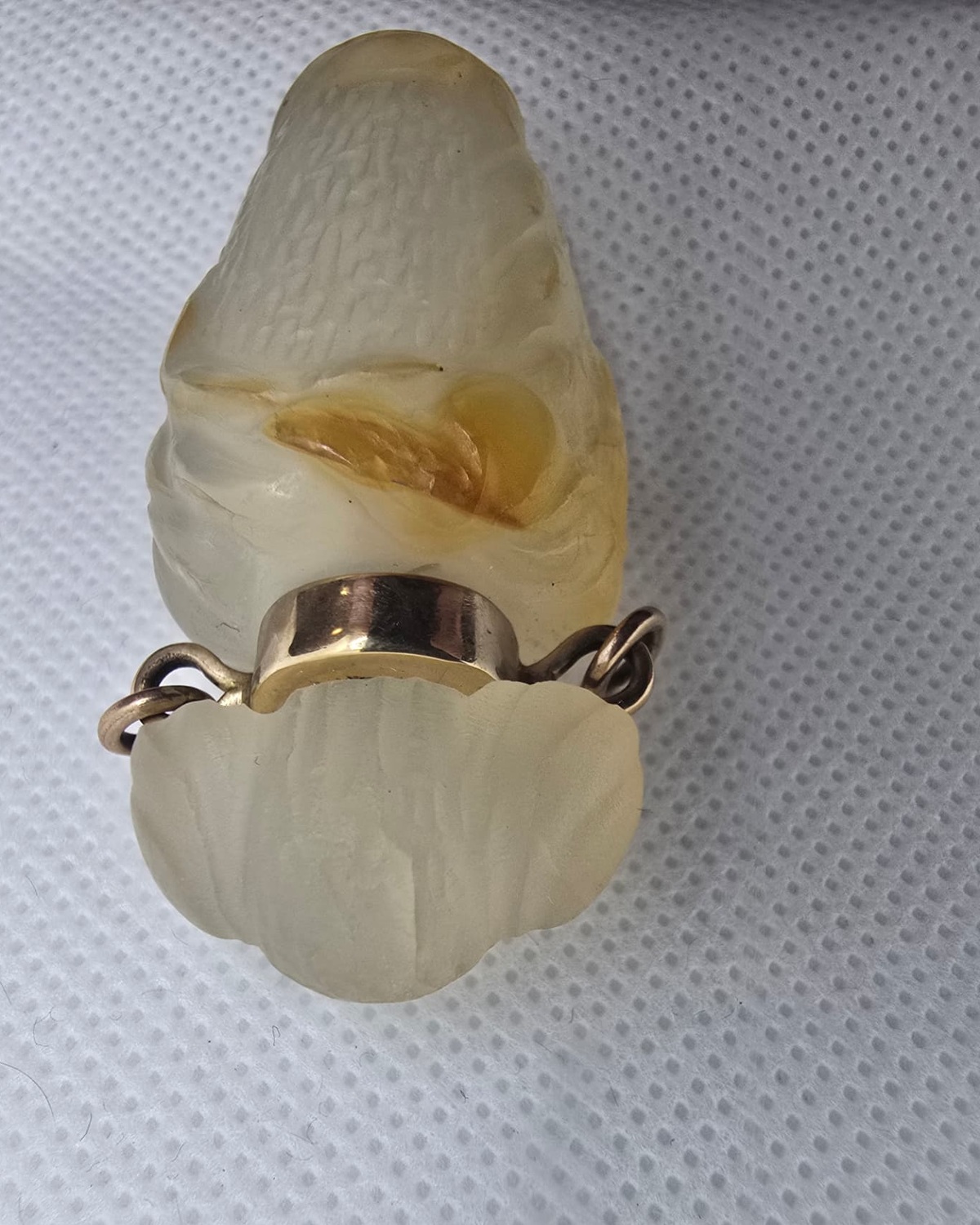 Pale jade vessel, gold collar and lobed stopper detail