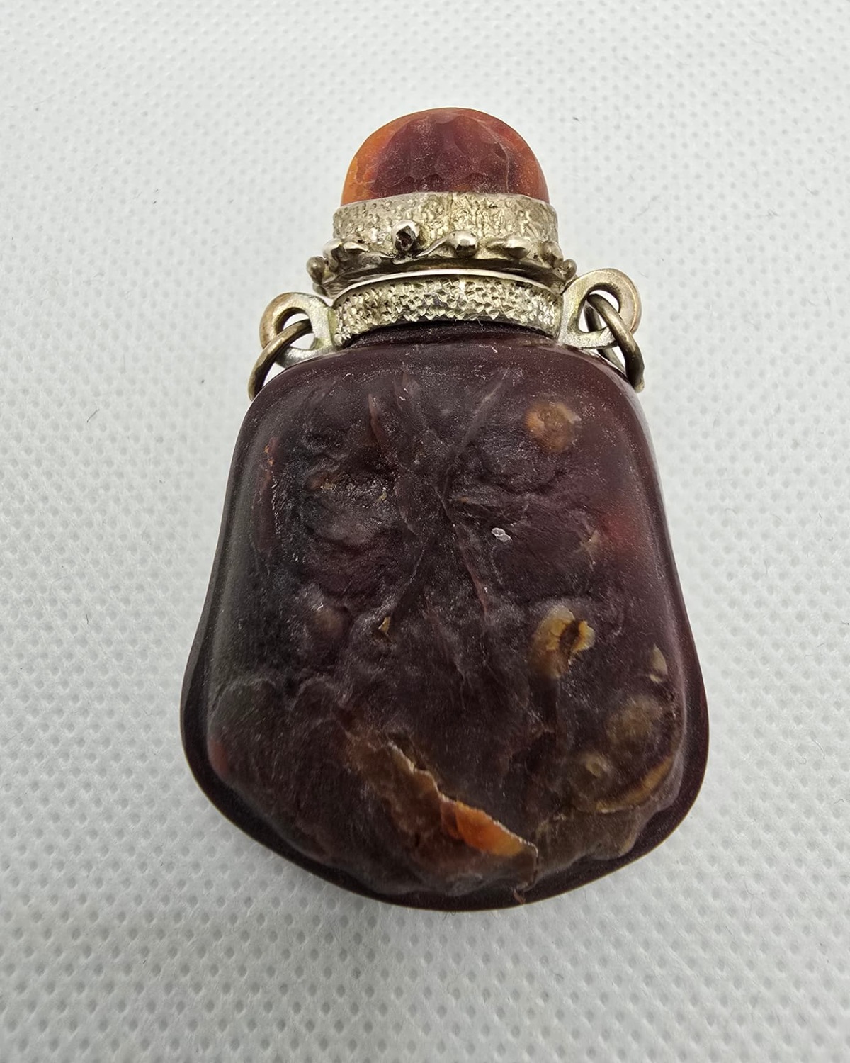 Red amber vessel with silver mount, front view