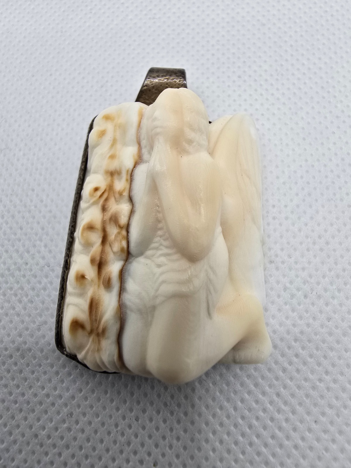 Angel in Prayer — hand-carved natural sea shell high-relief sculpture of an angel with bowed head and raised hands, mounted in a handcrafted silver setting