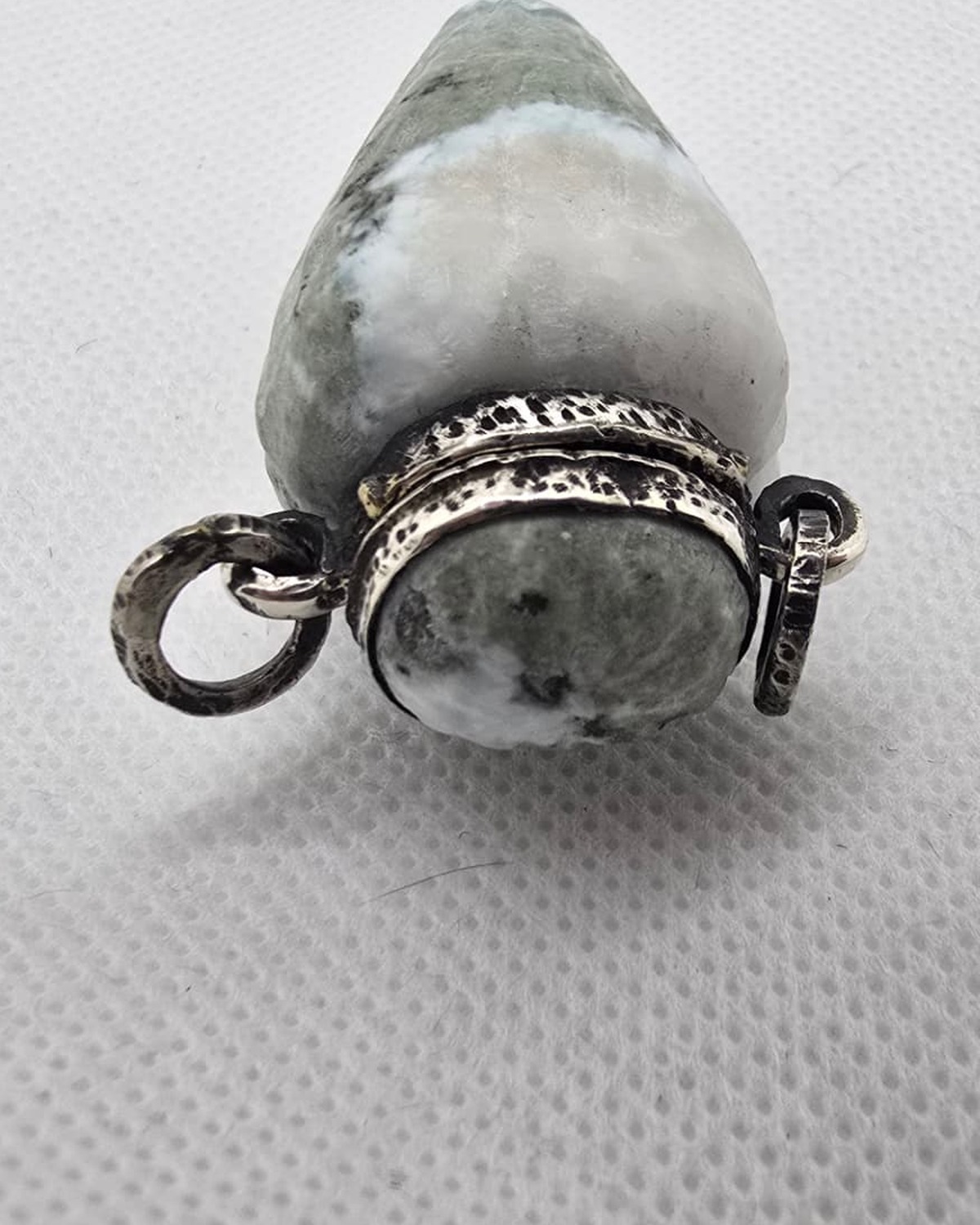 Hand-carved green and white stone vessel, neck and stopper detail