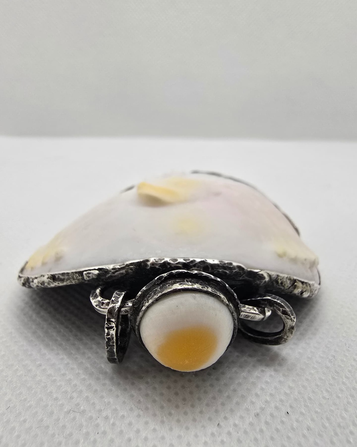 Carved sea shell eagle vessel, shell stopper and collar detail