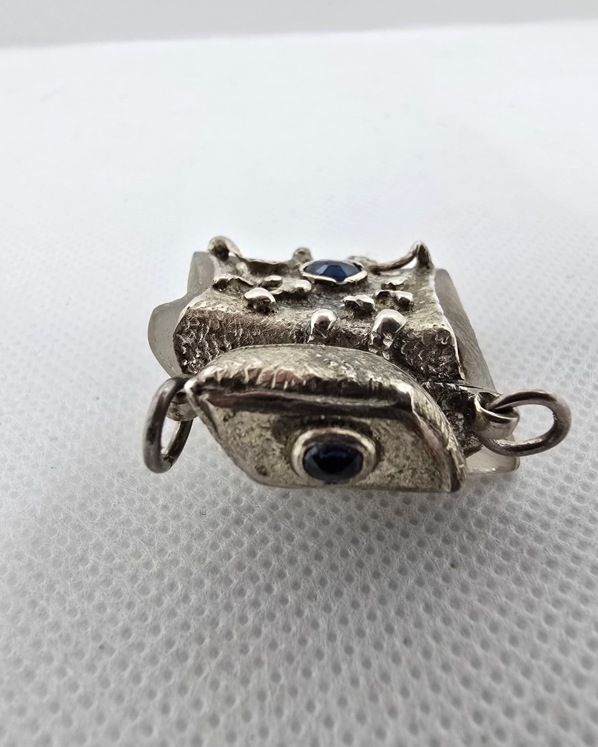 Crystal and sapphire silver flask, profile view