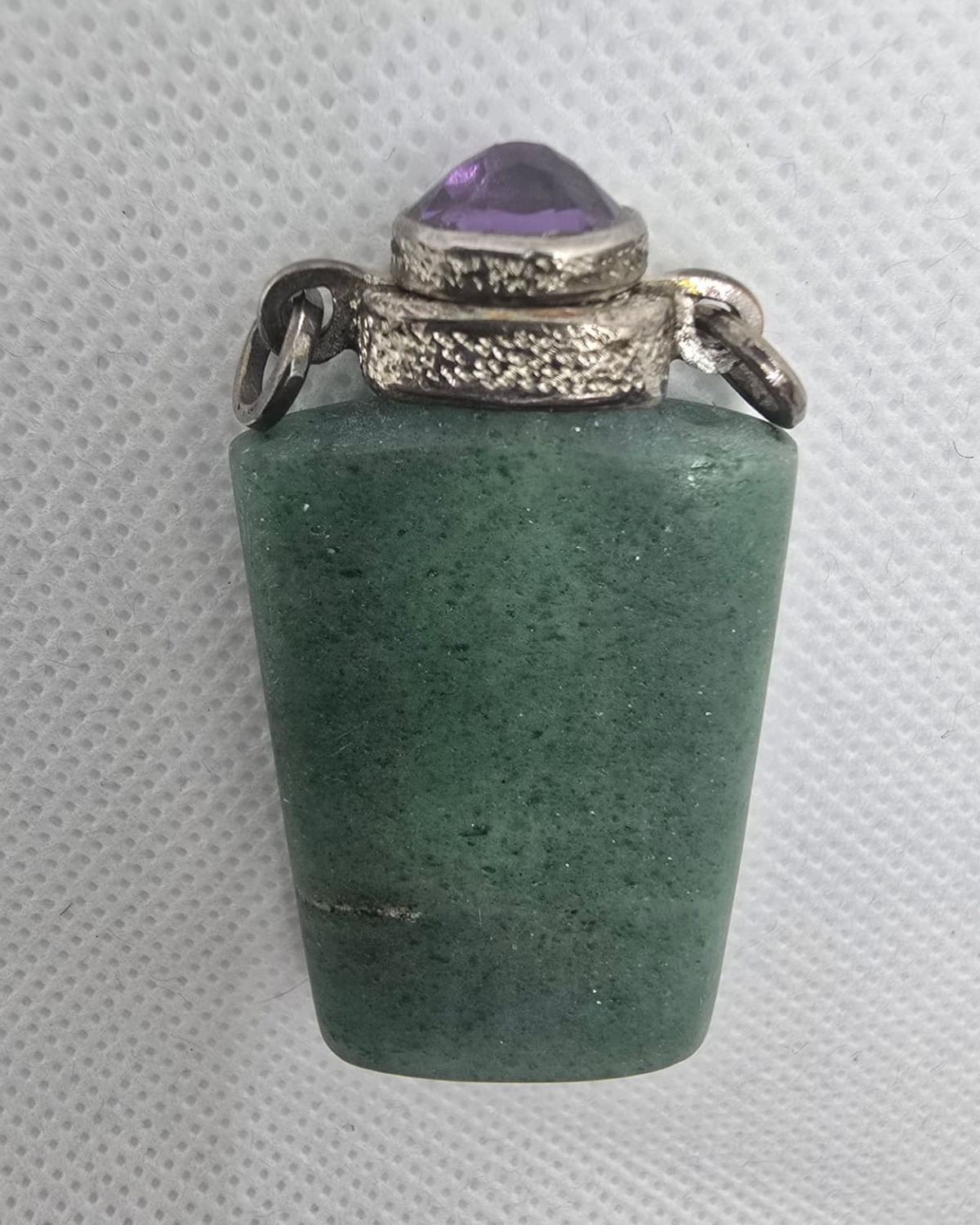 Green aventurine vessel with silver collar and amethyst stopper, front view