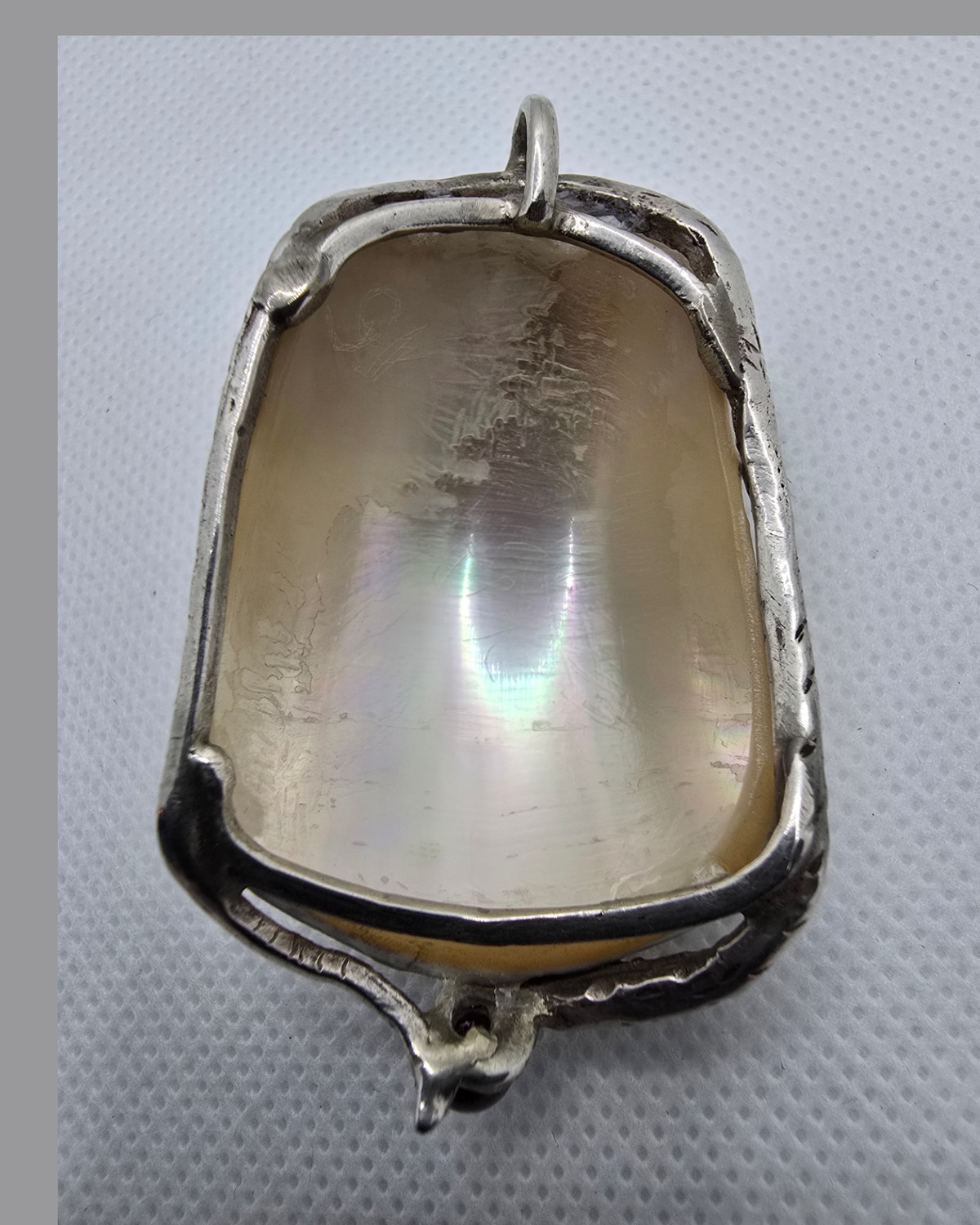 The Garden of Eden — reverse showing the open silver framework and the natural iridescent nacre of the shell