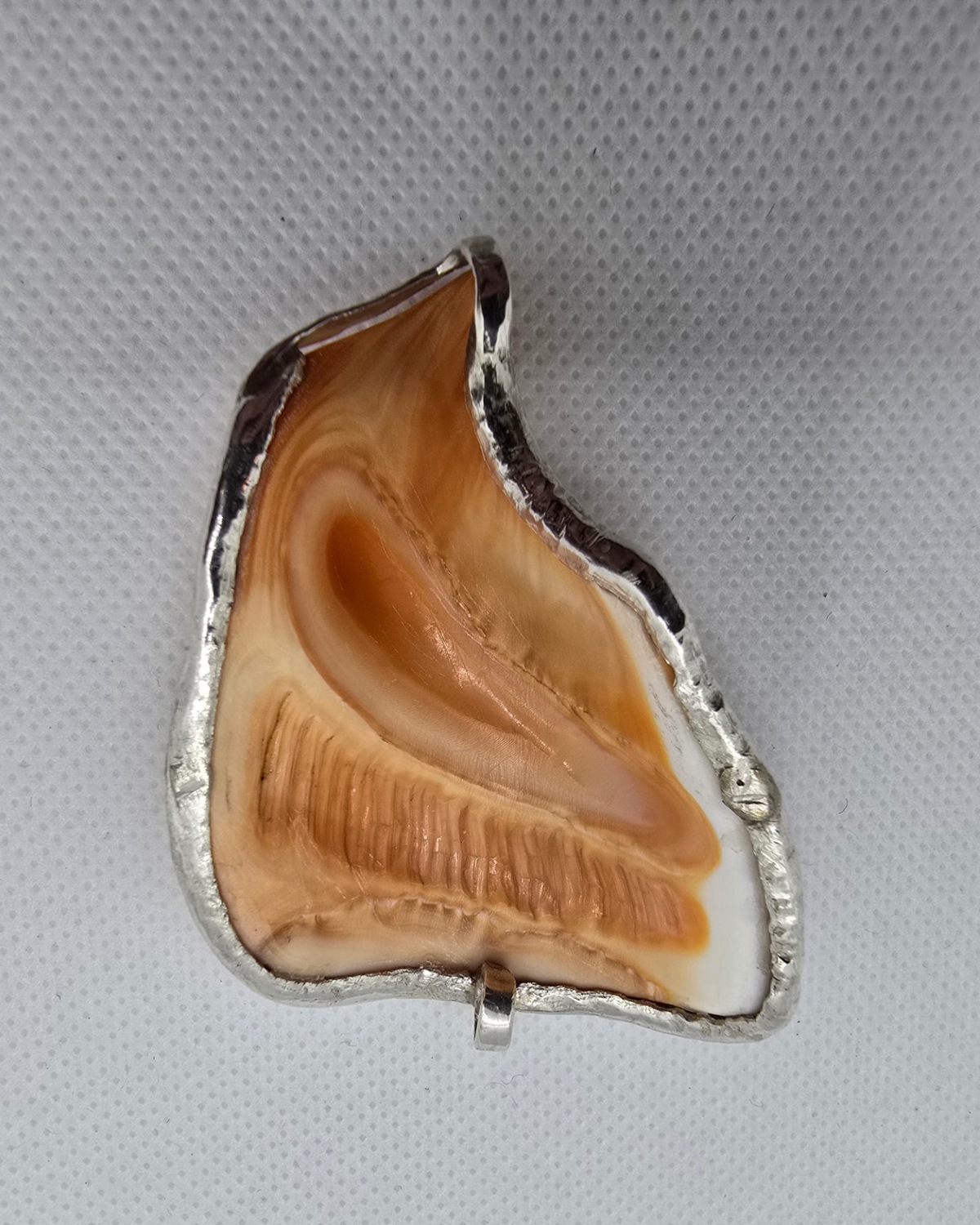 Spirit of the Chief — reverse of the shell with the handmade silver-tone metal setting